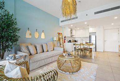 Bright living room with sofas and dining area